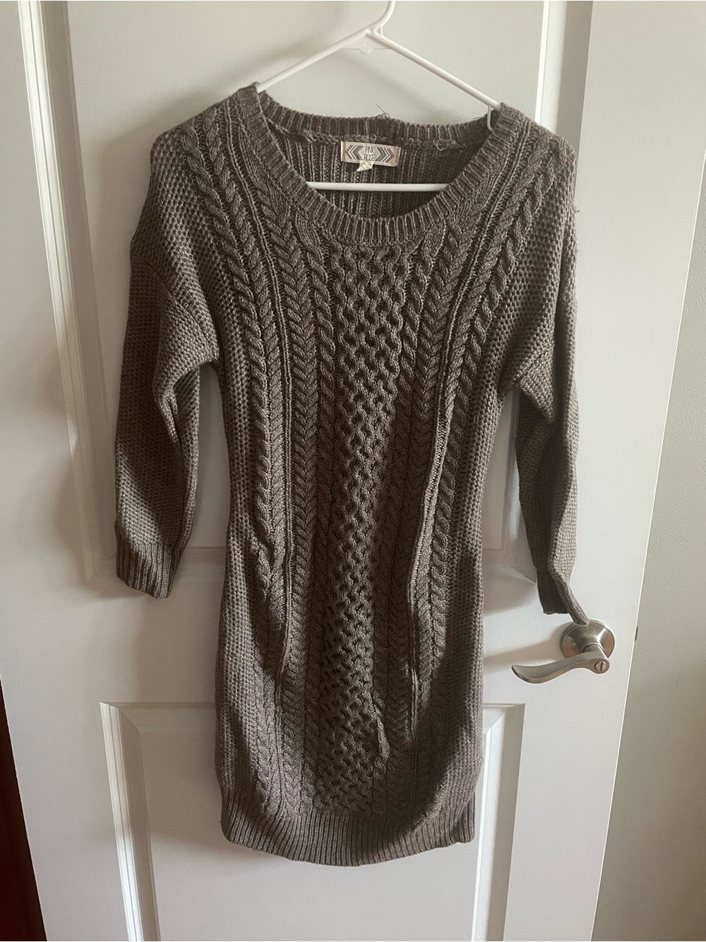 Woman’s pink rose cable knit dress